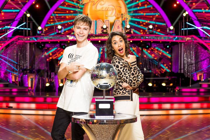 HRVY and Janette Manrara pose with the glitterball trophy