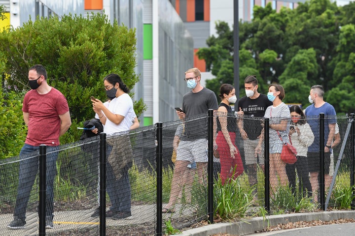 Members of the public wait in line for a COVID-19 test on Sunday evening at Royal North Shore hospital on December 20, 2020 in Sydney, Australia. 