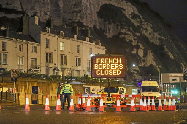 Police and port staff turn away vehicles from the Port of Dover in Kent on Monday morning. 