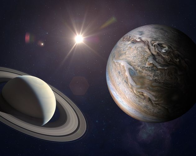 Jupiter approaching Saturn.  Next to Saturn is the Earth.  Provided by NASA