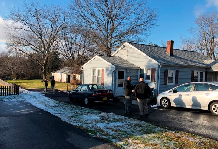 Local sheriff's detectives, agents with Homeland Security Investigations, and the Northern Virginia / District of Columbia Internet Crimes Against Children Task Force are seen searching Larson's house in Catlett, Virginia, last week.