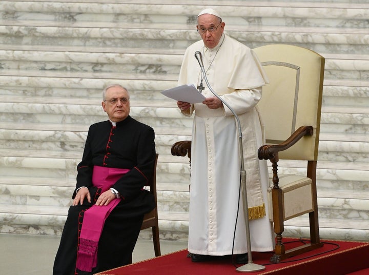 Pope Francis, flanked by Monsignor Leonardo Sapienza, delivers his Christmas greetings to the employees of the Vatican on Mon
