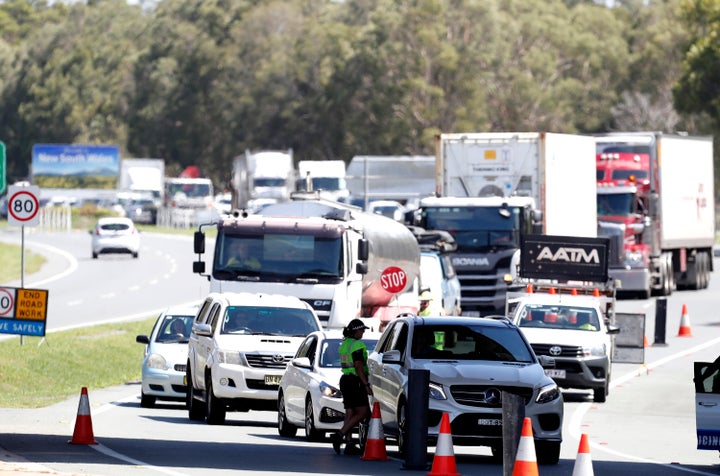 Long queue of motorists who are entering Queensland from New South Wales through the border checkpoint on December 21, 2020 in Coolangatta, Gold Coast, Australia.