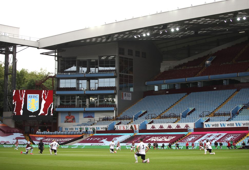 Players of Aston Villa and Sheffield United take a knee in support of the Black Lives Matter movement prior to the Premier League soccer match between the two teams at Villa Park on June 17 in Birmingham, England.
