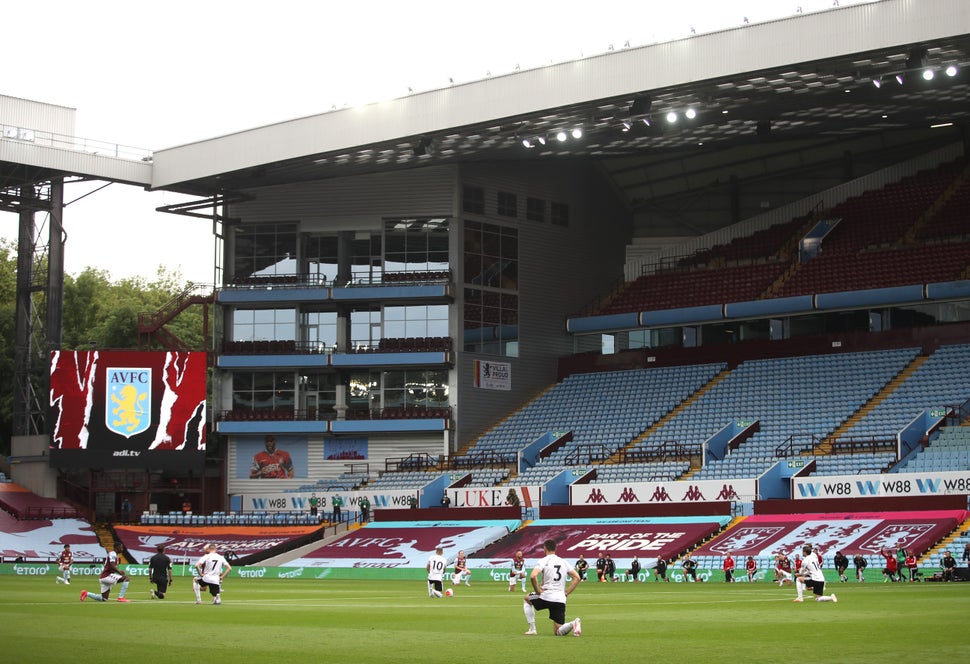 Players of Aston Villa and Sheffield United take a knee in support of the Black Lives Matter movement prior to the Premier Le