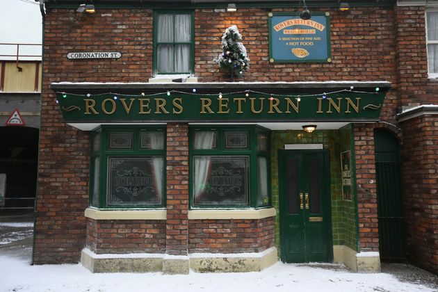 The famous Rovers Return is decorated for Christmas as the set of television soap Coronation Street is covered in fake snow for the festive season in 2014