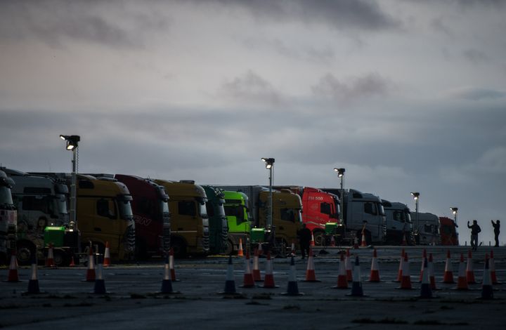 Lorries are parked on the runway at Manston Airfield at sunrise as part of Operation Brock to stack lorries waiting to cross the English Channel on December 22