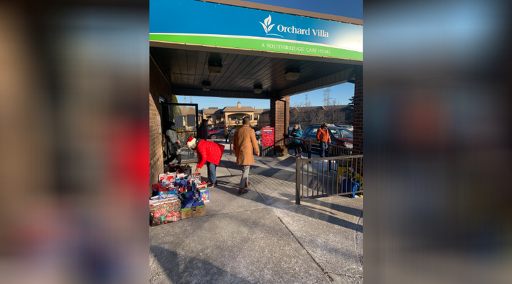 Volunteers drop off gifts at Orchard Villa long-term care home in Pickering, Ont.