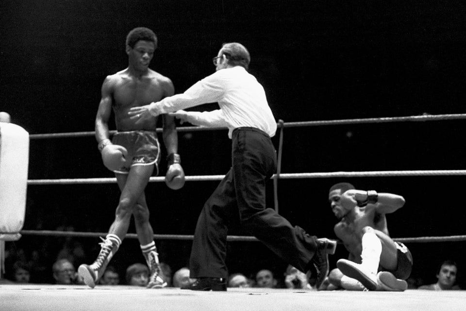 Vernon Vanriel looks down at Sammy Young