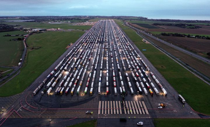 An aerial view shows lines of freight lorries and heavy goods vehicles parked on the tarmac at Manston Airport near Ramsgate, south east England on December 22.