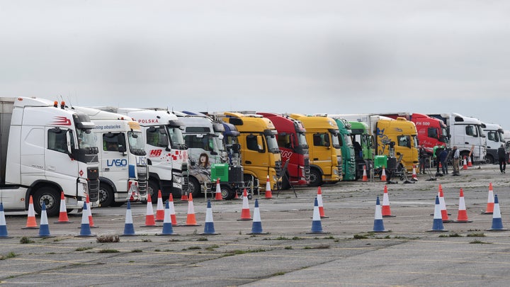 <strong>Freight lorries lined up at the front of the queue on the runway at Manston Airport, Kent, after France imposed a 48-hour ban on entry from the UK in the wake of concerns over the spread of a new strain of coronavirus.</strong>