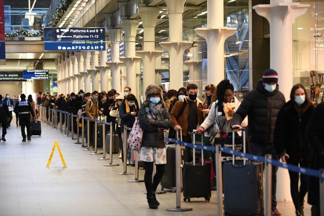 People waiting for the Eurostar train from St Pancras station in London, England to Paris, France.  In response to the virus outbreak, neighboring countries temporarily banned or restricted entry from the UK.  2020