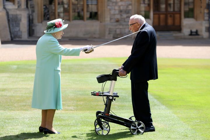 Britain's Queen Elizabeth awards Captain Tom Moore with the insignia of Knight Bachelor at Windsor Castle, in Windsor, Britain July 17, 2020. Chris Jackson/Pool via REUTERS TPX IMAGES OF THE DAY