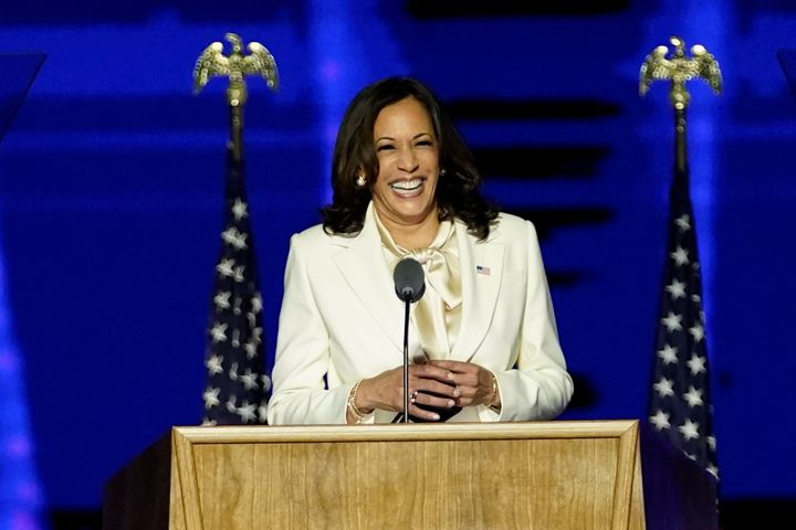 Democratic vice-presidential nominee Kamala Harris smiles as she speaks to supporters at a election rally, after news media announced that Biden had won the 2020 US presidential election