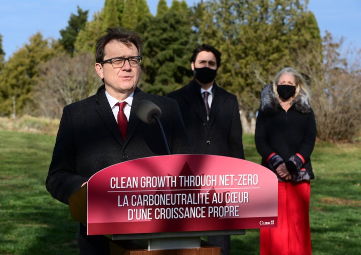 Minister of Environment and Climate Change Jonathan Wilkinson, left, with Prime Minister Justin Trudeau and Minister of Infrastructure and Communities Catherine McKenna at the Ornamental Gardens in Ottawa on Nov. 19, 2020.