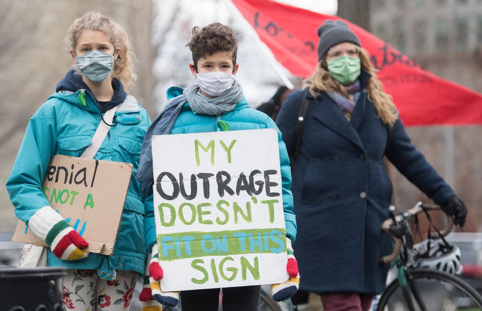 People take part in a climate change protest in Montreal on Nov. 21, 2020, as the COVID-19 pandemic continues...