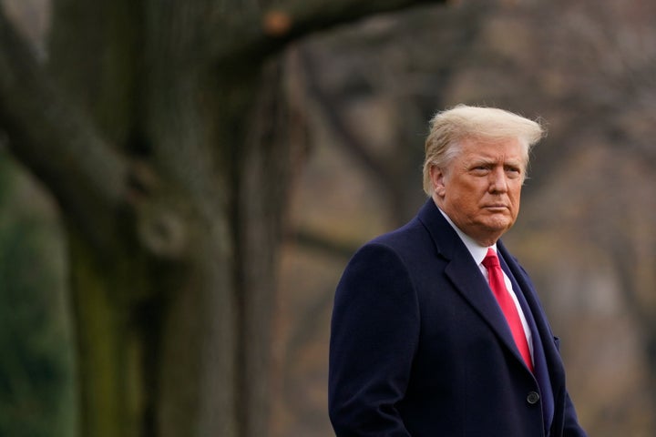 President Donald Trump walks on the South Lawn of the White House in Washington, D.C., before boarding Marine One on Dec. 12.