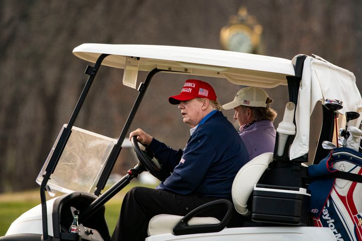 President Donald Trump drives golf cart number 45 at Trump National Golf Club on Dec. 13, 2020, in Sterling, Virginia.