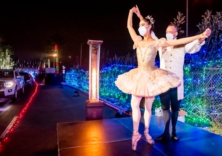 Dancers Susan Vishmid (left) and A.J. Abrams perform Dec. 13 for visitors touring the "Light of the World: Christmas Lights" 