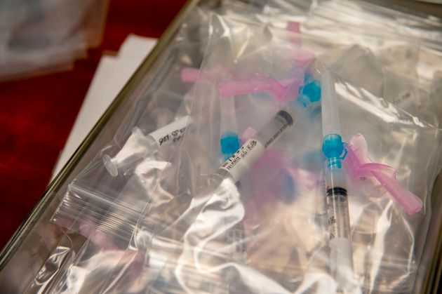 The pre-filled syringes fill a container, with the Modern Covid-19 Vaccine, ready to be administered to ...