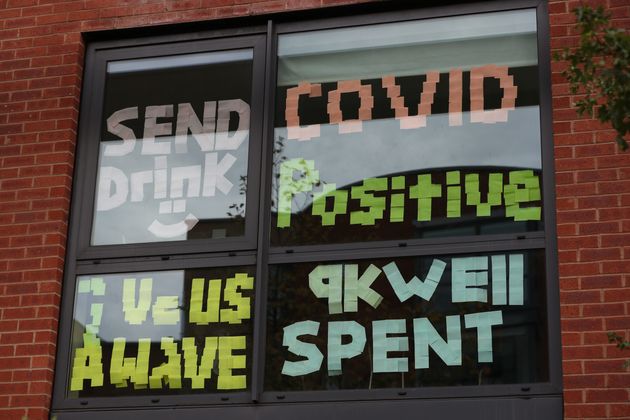 Signs on a window at Manchester Metropolitan University's Birley campus where hundreds of students were told to self-isolate in September