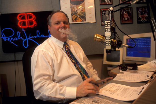 Rush Limbaugh smoking a cigar while taping his radio show.