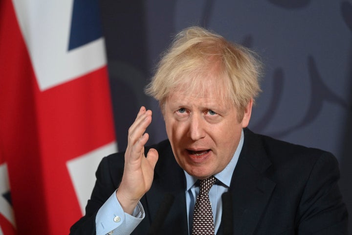 Britain's Prime Minister Boris Johnson arrives for a media briefing in Downing Street, London, Thursday, Dec. 24, 2020. Brita