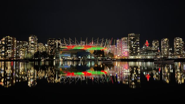 A view of Vancouver's BC Place lit in red and green on December 24,