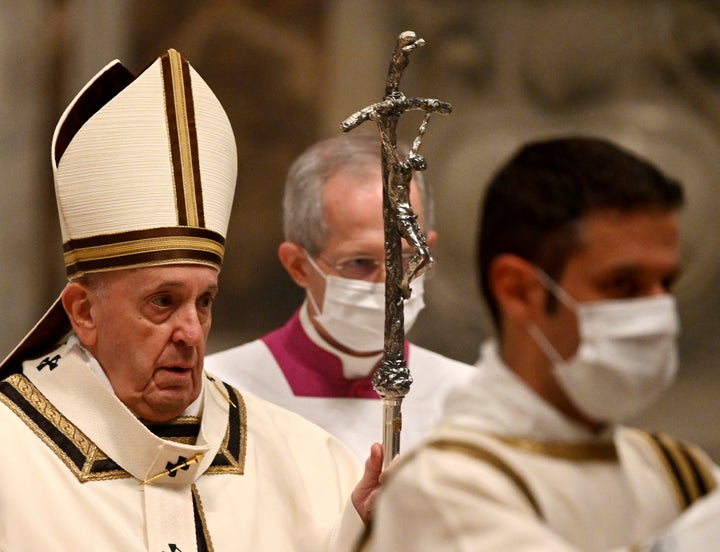 Pope Francis arrives to celebrate Mass on Christmas eve, at St. Peter's basilica at the Vatican, Thursday, Dec. 24, 2020. (Vi