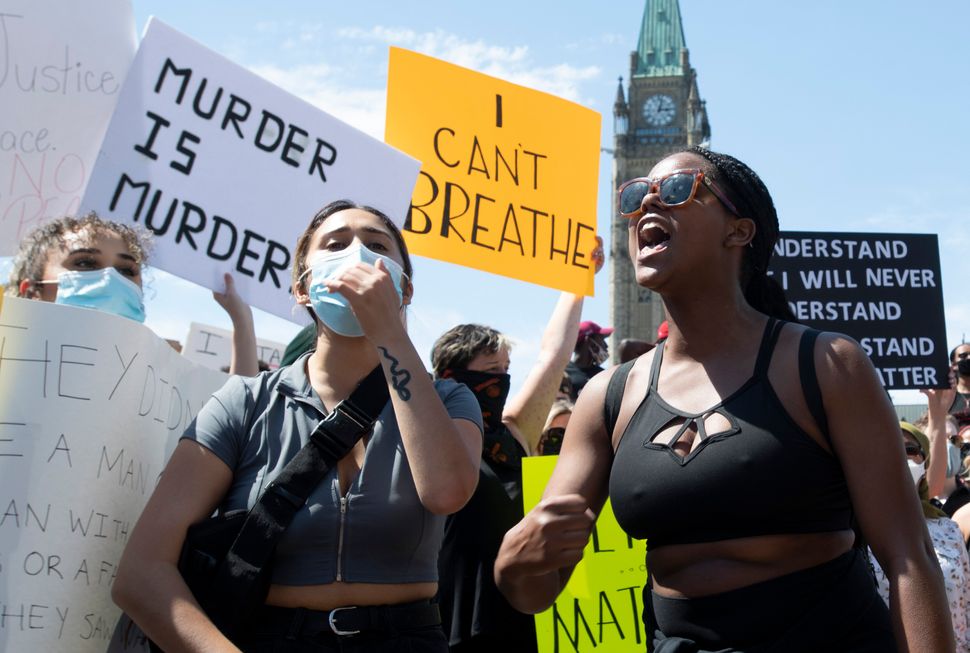 Protesters chant near the Parliament Building during a Black Lives Matter protest in Ottawa on June 5, 2020.