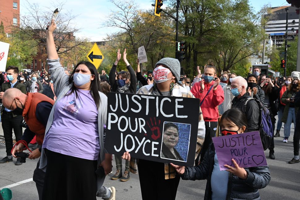 Protesters gather during a demonstration in central Montreal on Oct. 3, 2020, to demand action for the death of Joyce Echaquan, an Atikamekw woman subjected to live-streamed racist slurs by hospital staff before her death.