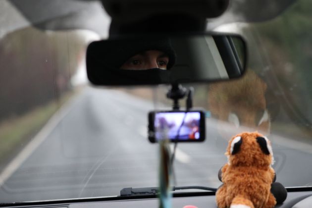 A member of the Manchester Hunt Saboteurs drives along a road in North Yorkshire searching for people participating in Boxing Day Hunts. 