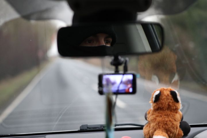 A member of the Manchester Hunt Saboteurs drives along a road in North Yorkshire searching for people participating in Boxing Day Hunts. 