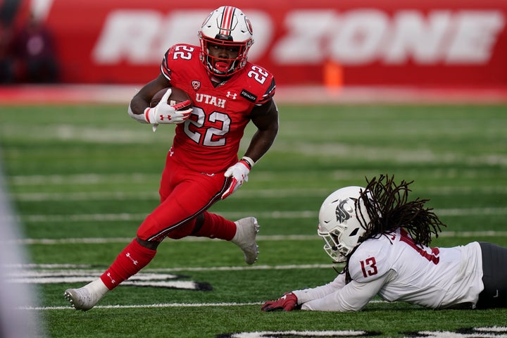 Utah running back Ty Jordan eludes a tackle by Washington State linebacker Jahad Woods during the second half of an NCAA college football game earlier this month.