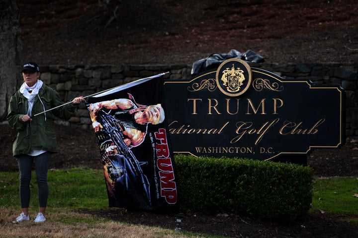 A supporter of President Donald Trump waits outside the Trump National Golf Club as the president played golf on Dec. 13 in Sterling, Virginia.