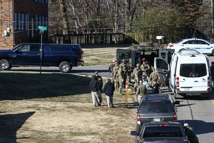 Law enforcement officers investigate the house belonging to Anthony Quinn Warner, a 63 year-old man who has been reported to be of interest in the Nashville bombing.