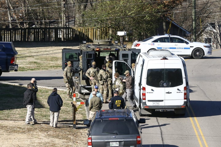 NASHVILLE, TENNESSEE - DECEMBER 26: Law enforcement officers investigate the house belonging to Anthony Quinn Warner, a 63 ye