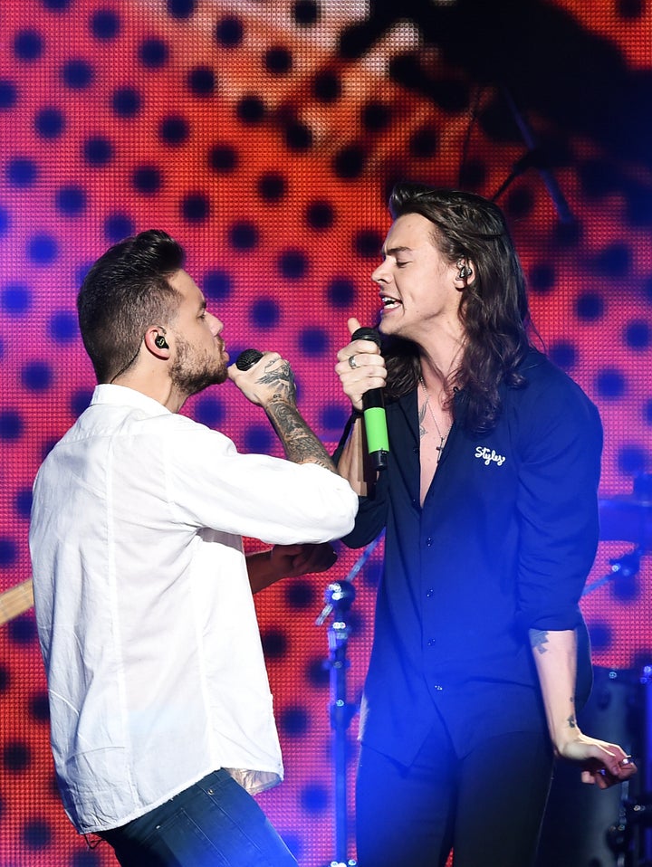 Liam Payne and Harry Styles performing together in 2015