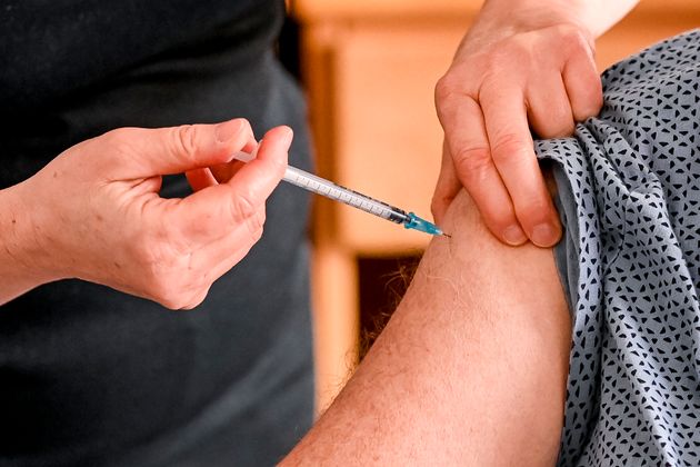 A nurse injects a dose of the Pfizer-BioNTech Covid-19 vaccine, during a vaccination operation in the ...