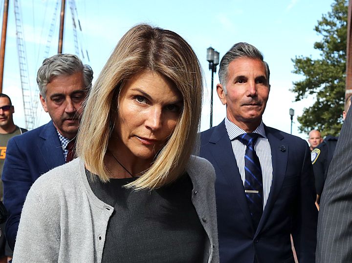 Lori Loughlin and her husband Mossimo Giannulli, right, leave the John Joseph Moakley United States Courthouse in Boston on August 27, 2019. 