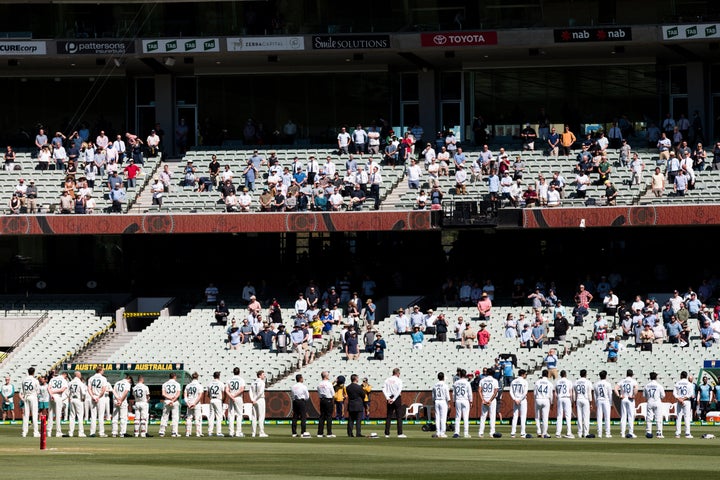 Players stand for the national anthems on day one of the Second Test match between Australia and India at the Melbourne Cricket Ground.