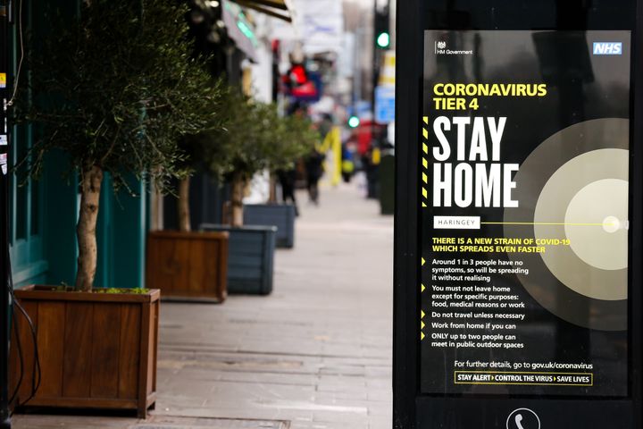 A 'Stay Home' sign seen in London as many parts of the UK are now in Tier 4 