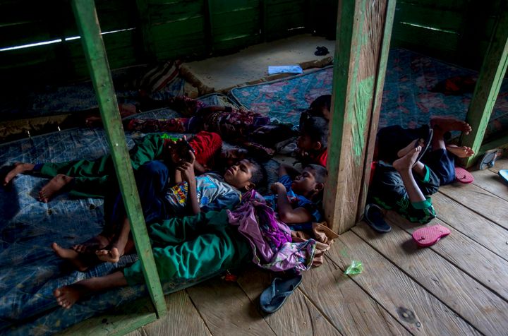 Students of a boarding school rest in their dormitory in North Kalimantan, Indonesia. Some palm oil workers who work illegall