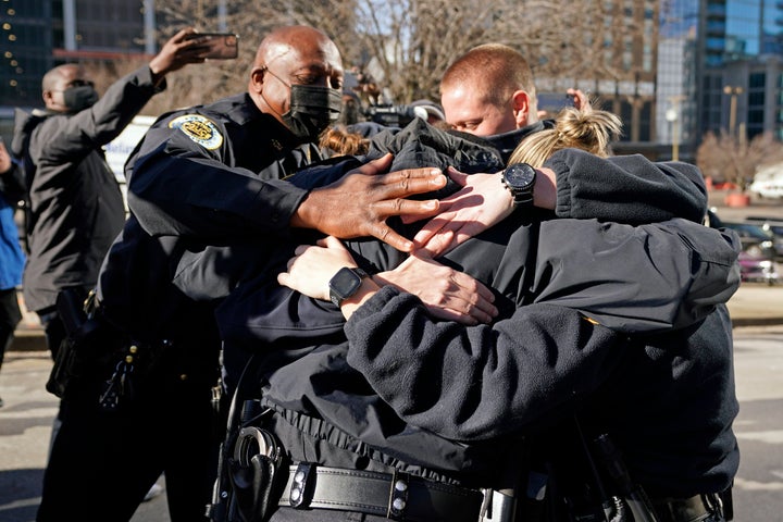 Nashville Police Chief John Drake (left) joins a group of police officers credited with evacuating people before an RV explod