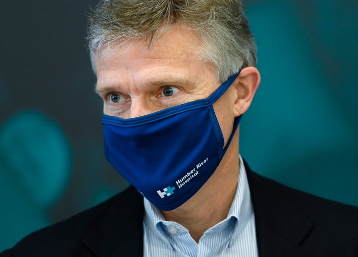 Ontario Finance Minister Rod Phillips looks on as he delivers baked goods and coffee to frontline health workers at Humber River Hospital in Toronto on Nov. 5, 2020.