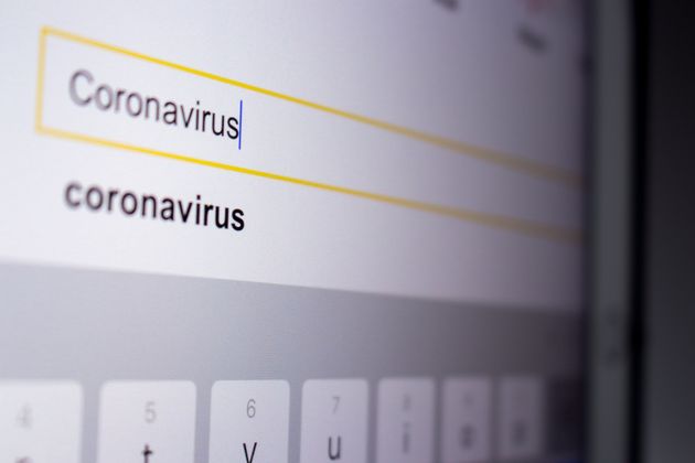 The image of Coronavirus in search bar in search engine on tablet screen.