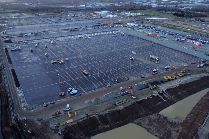 An aerial picture shows construction work continuing at the site of a lorry park being built between the villages of Sevington and Mersham, near the M20 motorway near Ashford in Kent, on December 17.