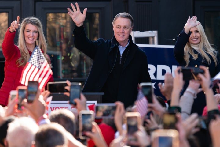 Georgia Sens. Kelly Loeffler (left) and David Perdue (center) campaign with Ivanka Trump on Dec. 21. They have painted the el