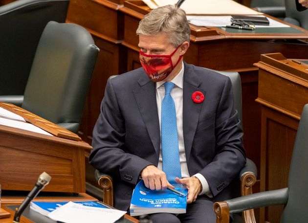 Ontario Finance Minister Rod Phillips autographs copies of the Provincial Budget for MPPs in the Ontario...