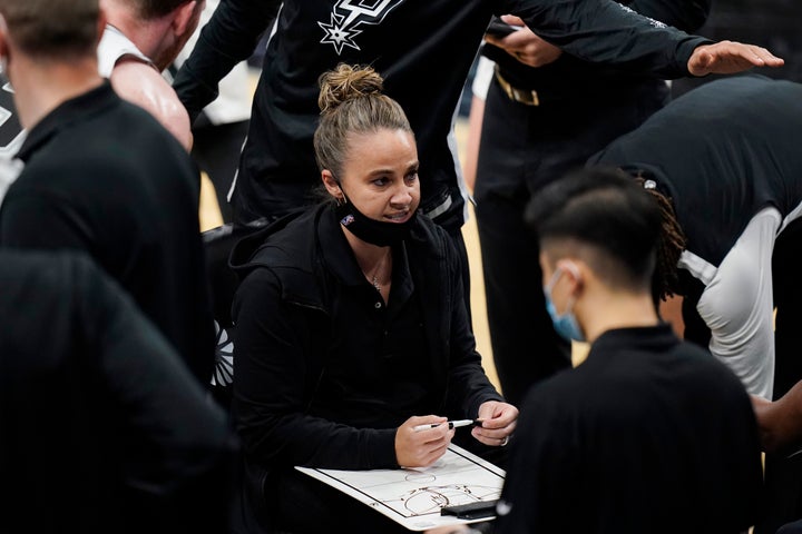 San Antonio Spurs assistant coach Becky Hammon calls a play during a timeout in the second half of the team's NBA basketball